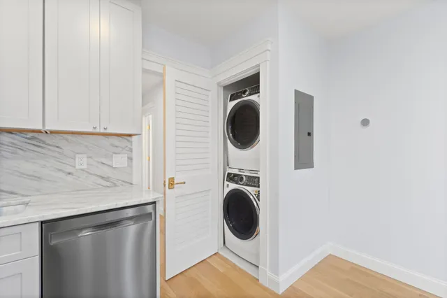 a view of a kitchen with washer and dryer
