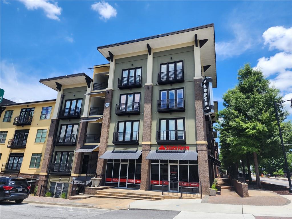 a front view of residential houses with street