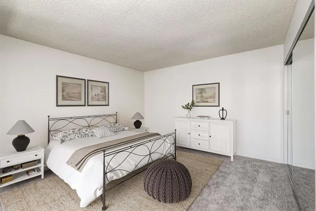 a bedroom with a bed and a cabinets