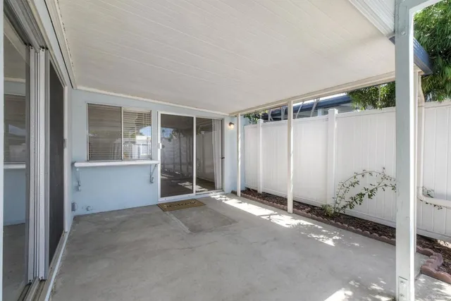 a view of an empty room with glass door