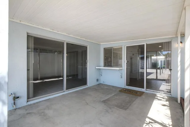 a view of empty room with floor to ceiling window