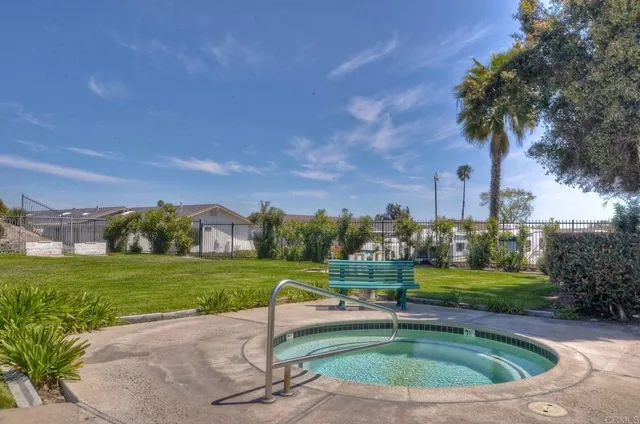 a sign that is sitting in front of a house