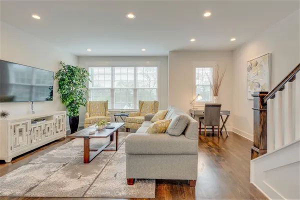 a living room with furniture and a table