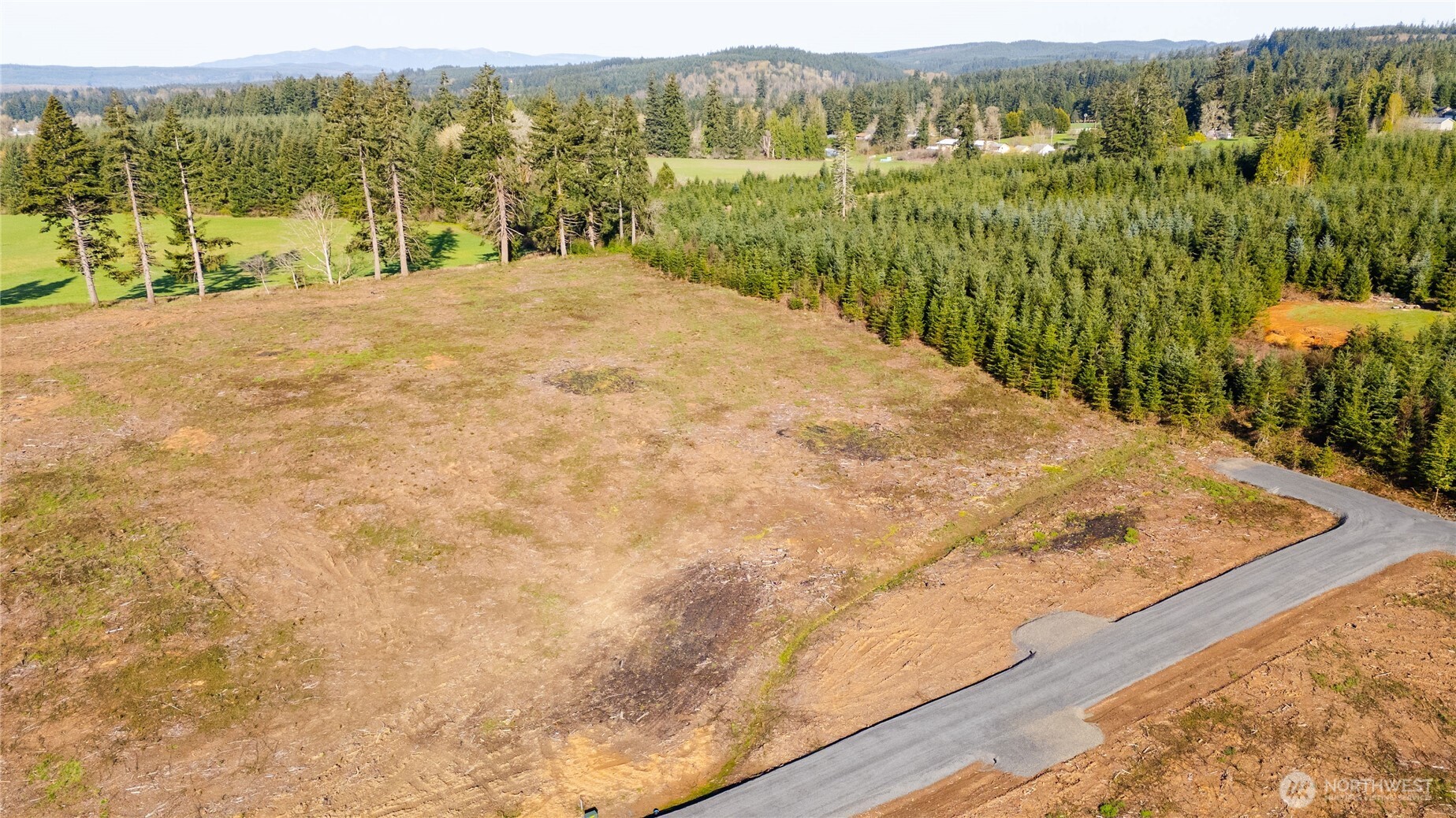 133 Beckett Lane Chehalis, WA 98532 - Photo 14 of 23 a view of a lake with mountain