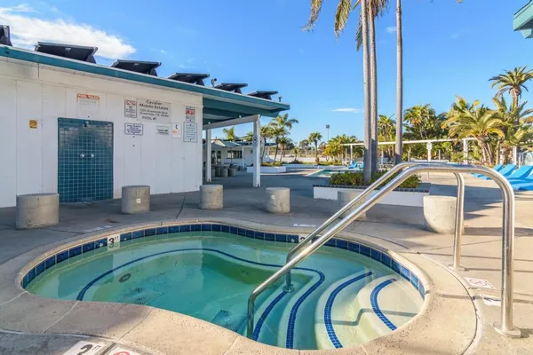 a view of a swimming pool with a lounge chairs