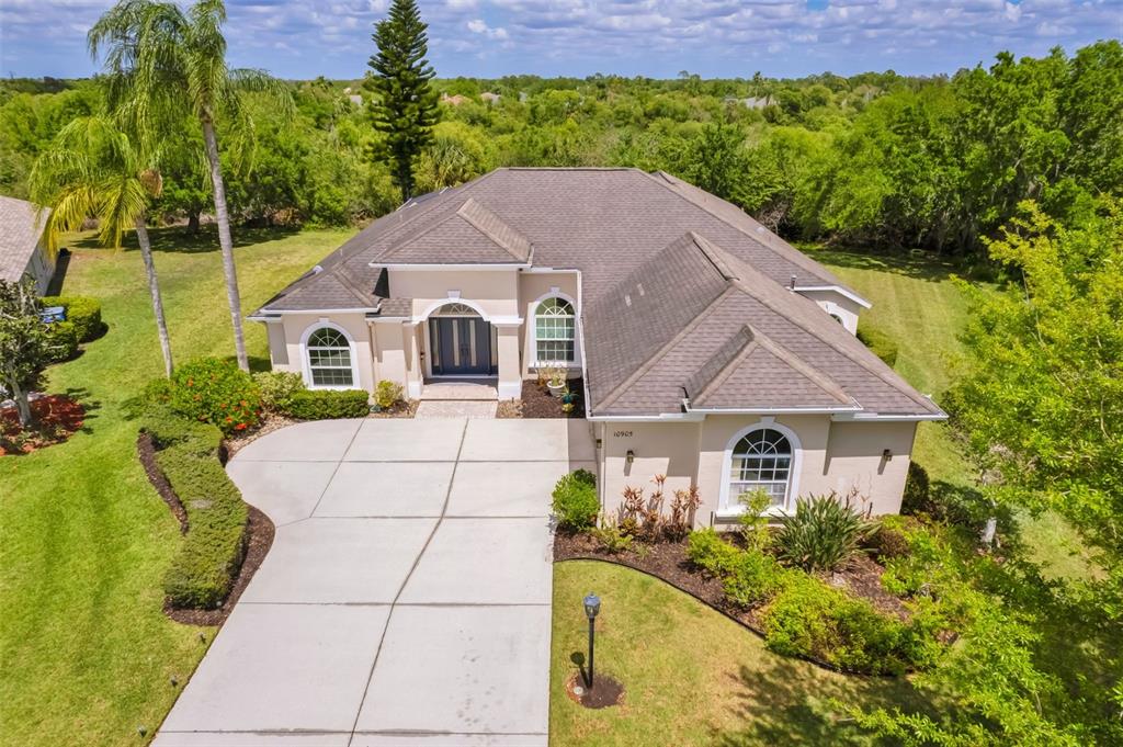 10905 Bullrush Terrace Lakewood Ranch, FL 34202 - Photo 1 of 1 a house with trees in the background