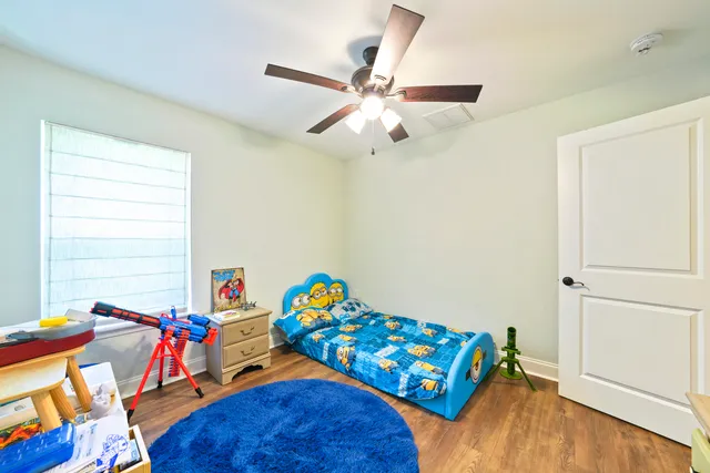 a bedroom with furniture and a bed