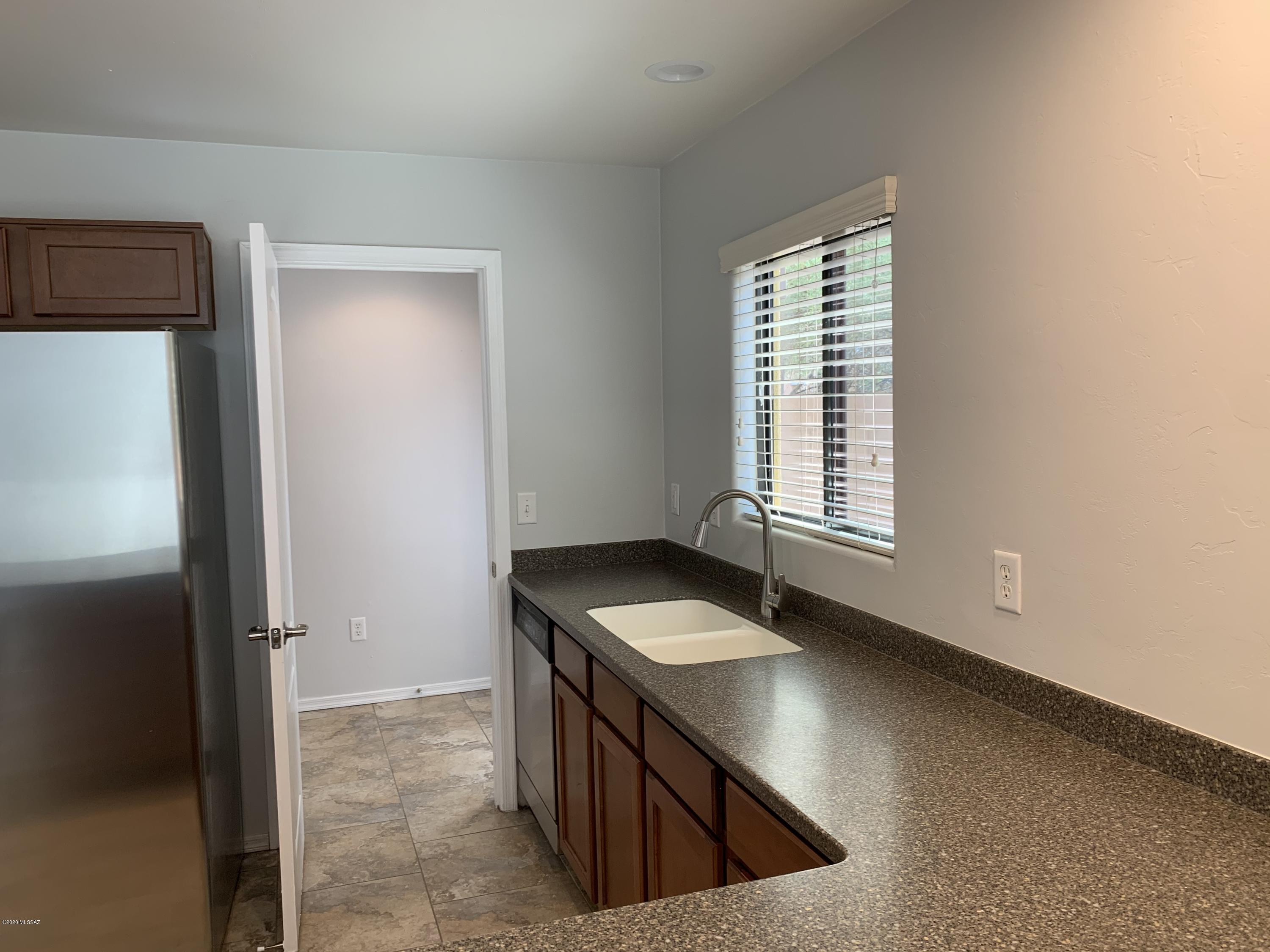 4181 North Fortune Loop Tucson, AZ 85719 - Photo 8 of 39 a kitchen that has a sink and a stove