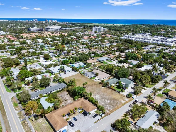 an aerial view of residential houses with outdoor space