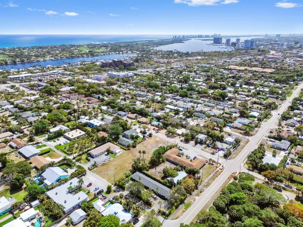 an aerial view of residential houses with city view