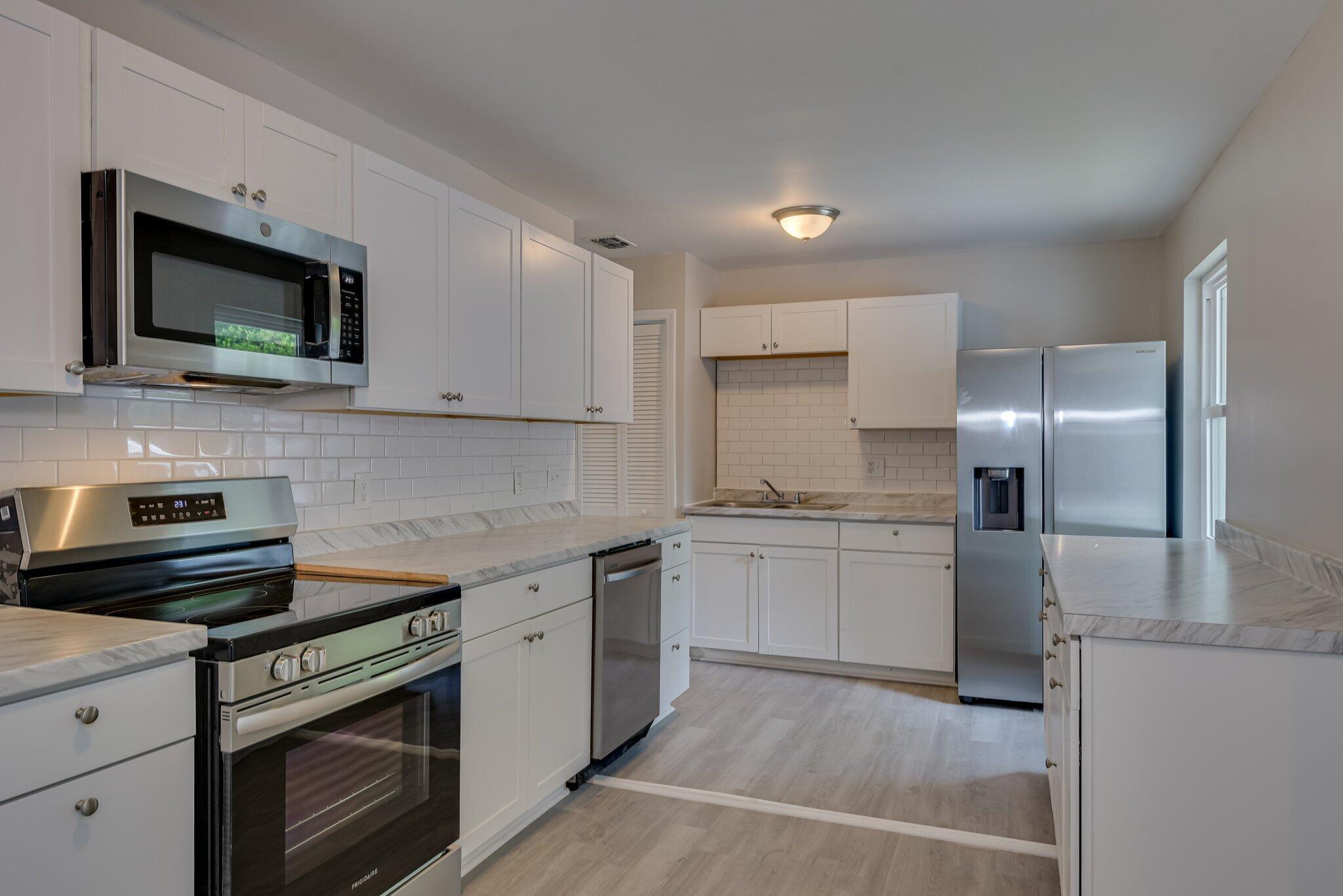 2115 Ashley Drive Augusta, GA 30906 - Photo 13 of 38 a kitchen with a sink stove and microwave