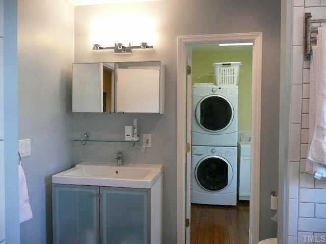 600 Edmund Street Raleigh, NC 27604 - Photo 11 of 12 Better than the new condos, the recently remodeled bath has subway white tile and updated vanity, lighting and fixtures, conveniently located next to the new laundry room with a deep sink. Other