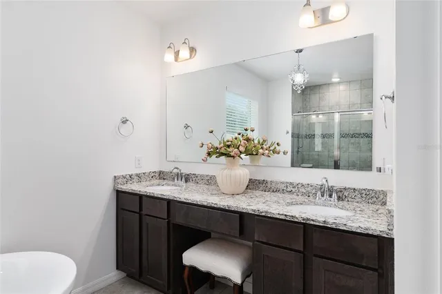 a view of a big house with a big yard and large trees