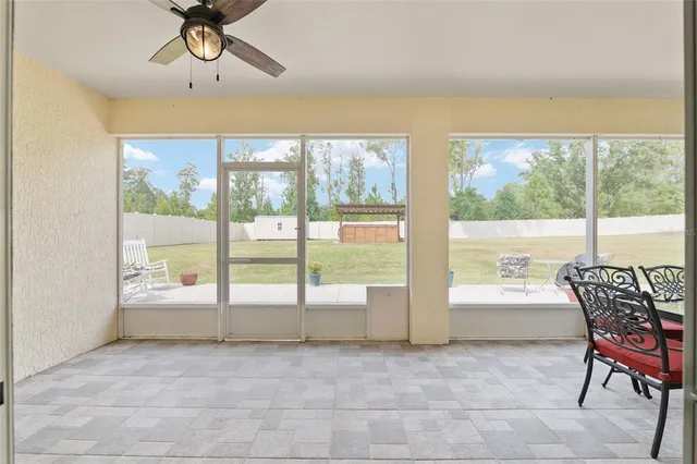 a view of a house with swimming pool and porch