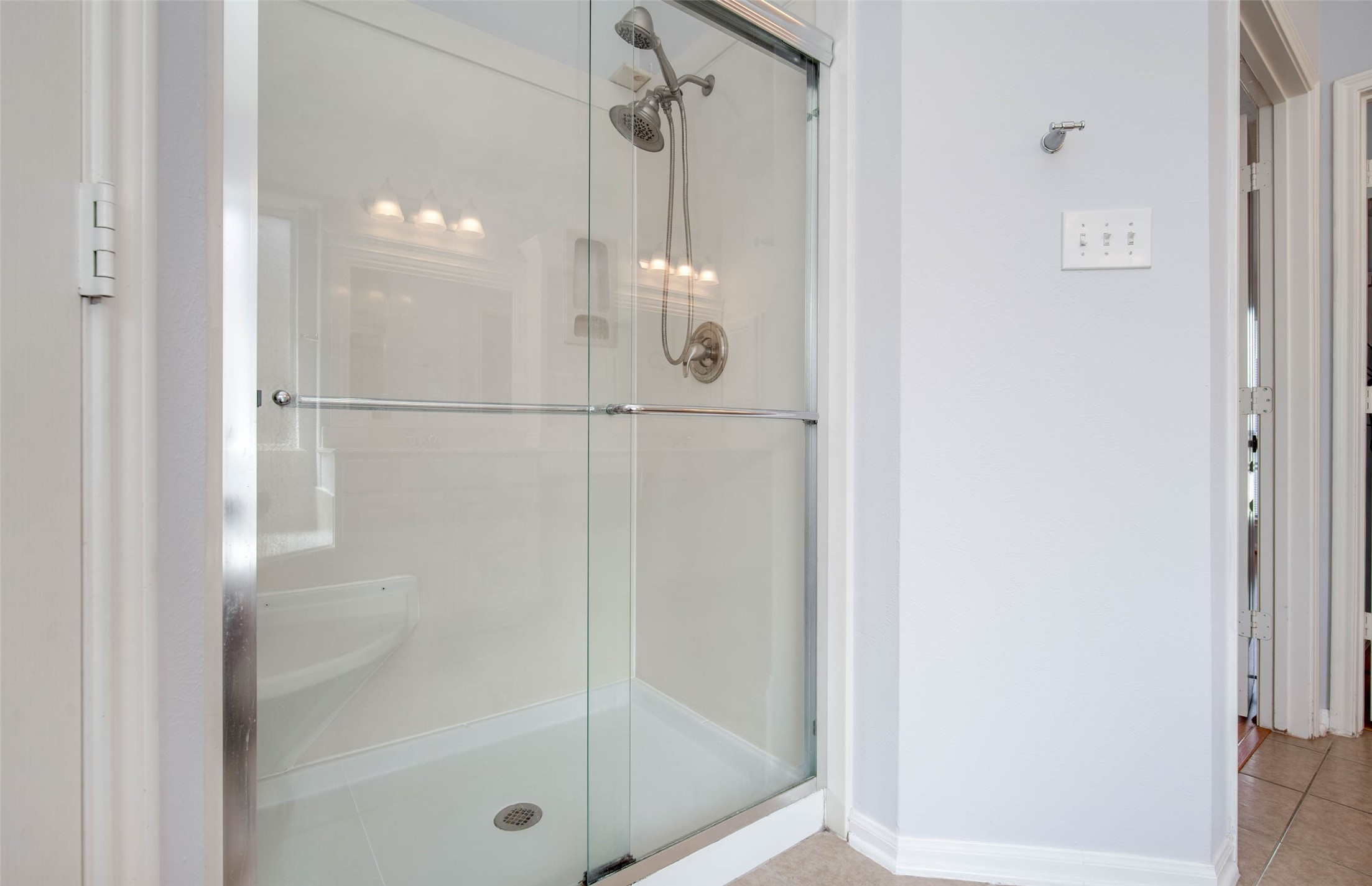 9323 Hillhaven Court Rosenberg, TX 77469 - Photo 28 of 37 a bathroom with a glass shower door