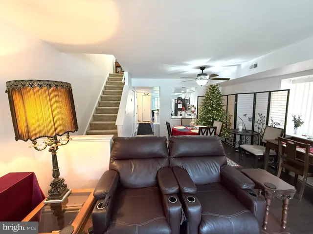 a view of a livingroom with furniture and a chandelier
