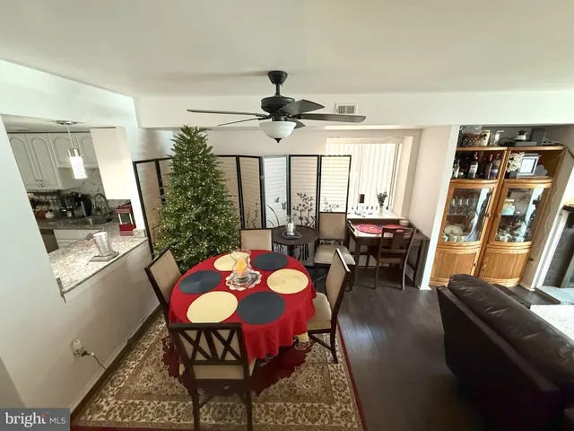 a view of a dining room with furniture and window