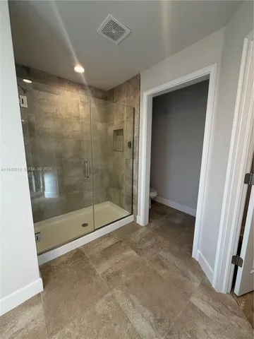a view of a bathroom with a shower