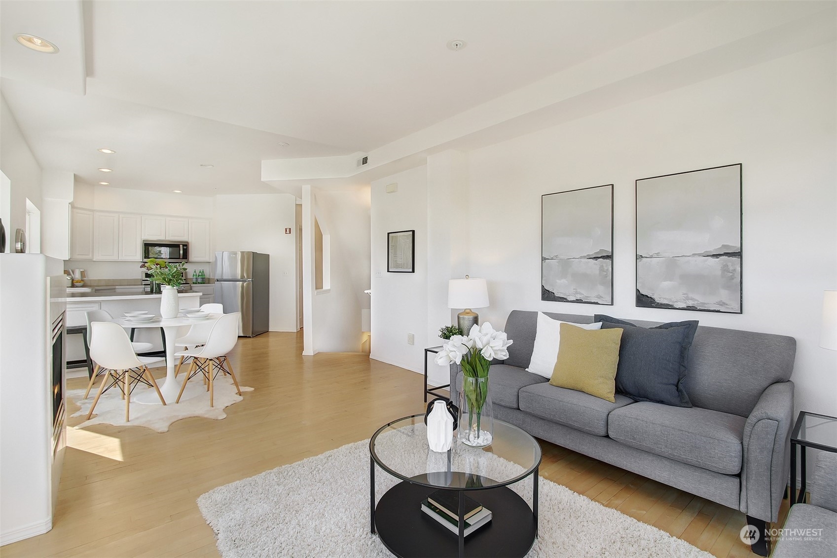307 North 73rd Street, Unit 5 Seattle, WA 98103 - Photo 14 of 33 a living room with furniture kitchen view and a table