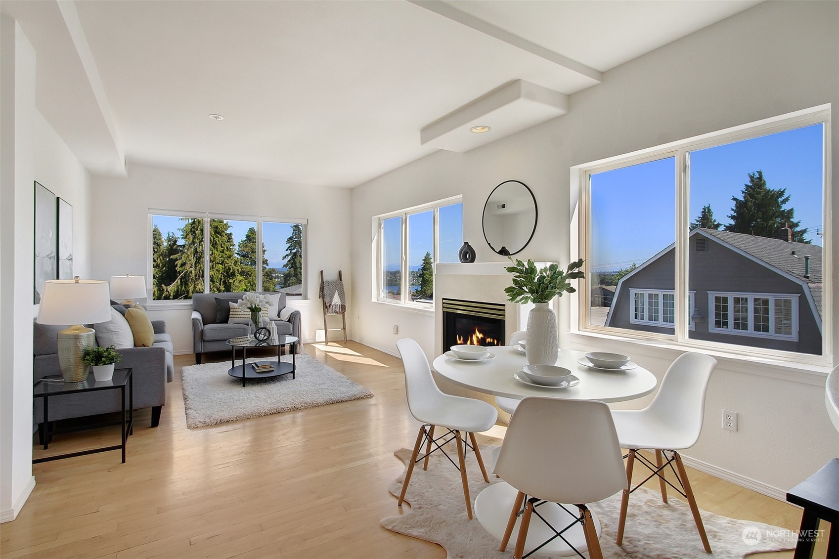 307 North 73rd Street, Unit 5 Seattle, WA 98103 - Photo 15 of 33 a living room with furniture a fireplace a rug and a large window