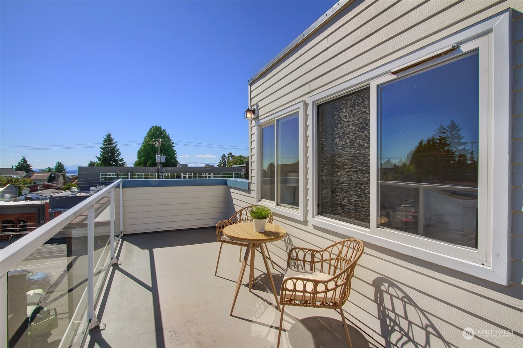 307 North 73rd Street, Unit 5 Seattle, WA 98103 - Photo 24 of 33 a balcony with table and chairs