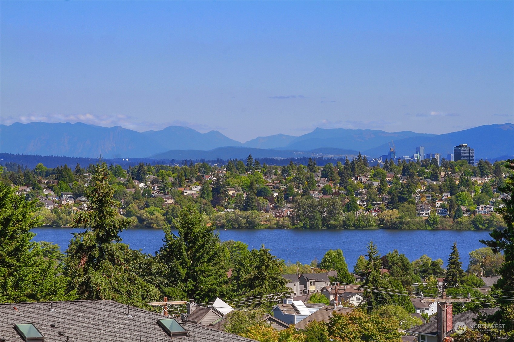 307 North 73rd Street, Unit 5 Seattle, WA 98103 - Photo 26 of 33 a view of a house with a yard and a garden