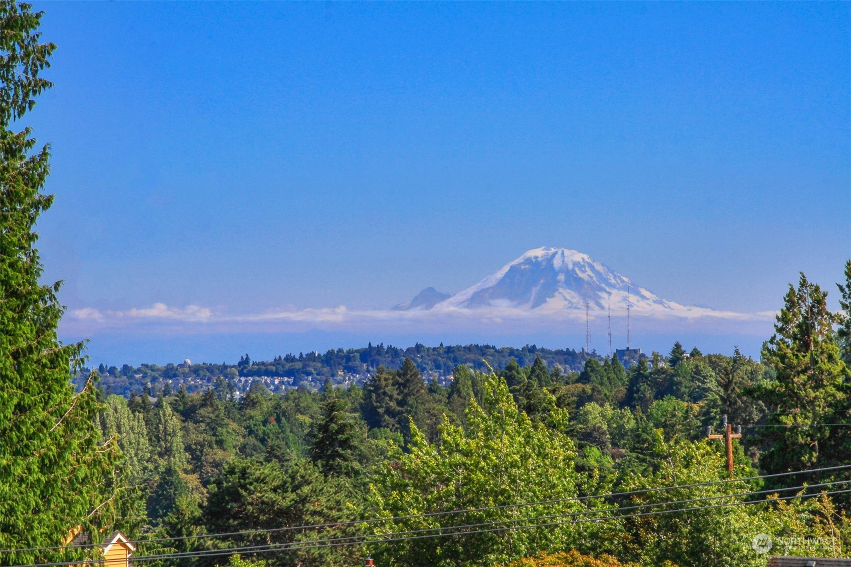 307 North 73rd Street, Unit 5 Seattle, WA 98103 - Photo 27 of 33 a view of a city with a mountain in the background