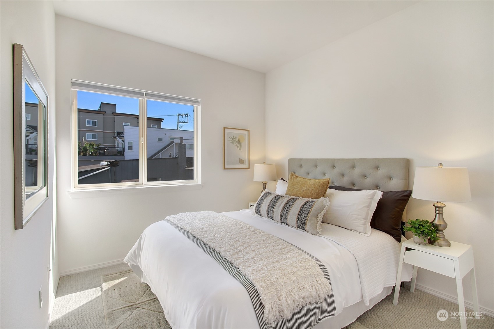 307 North 73rd Street, Unit 5 Seattle, WA 98103 - Photo 5 of 33 a bedroom with a large bed and a large window