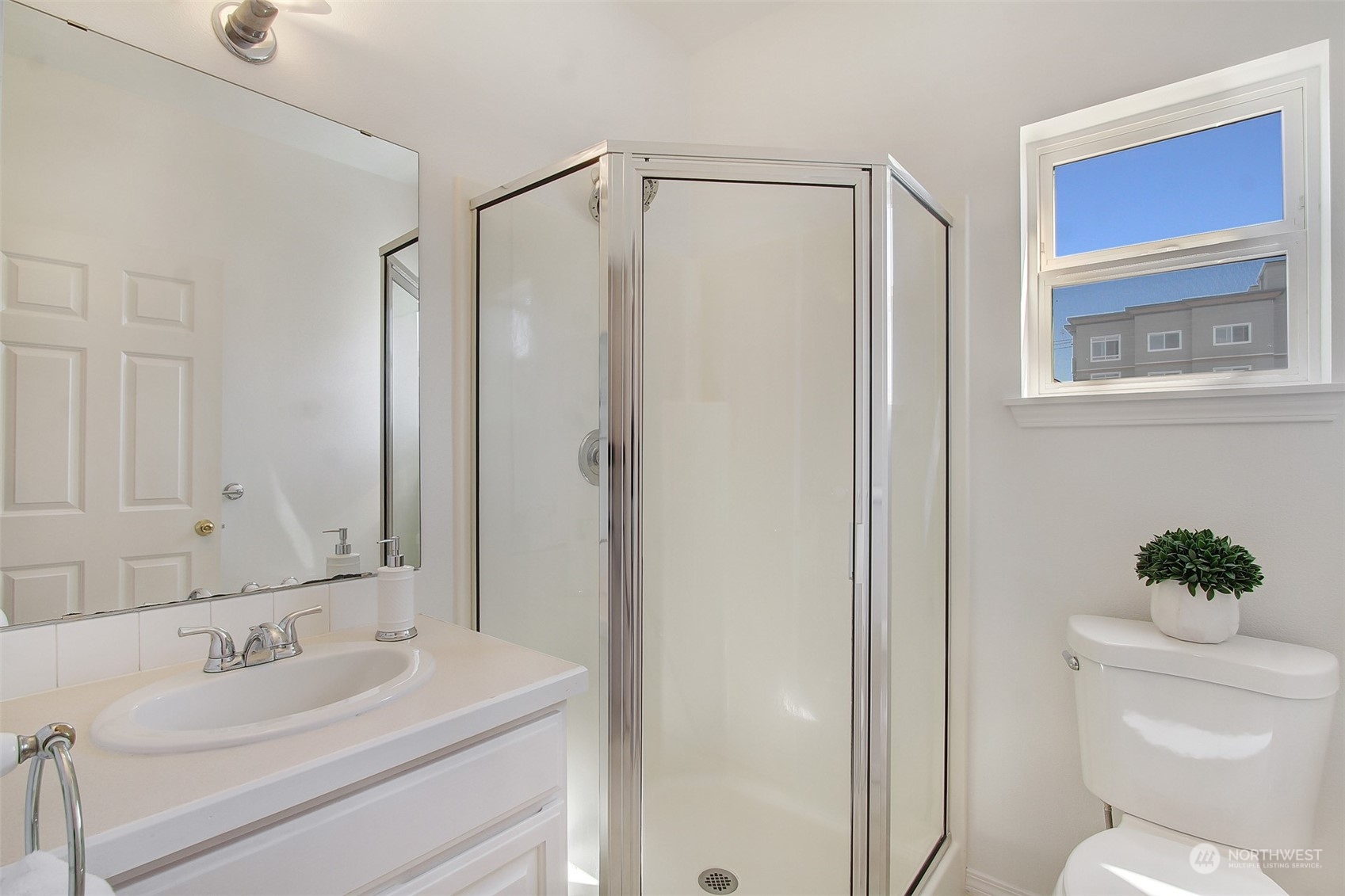 307 North 73rd Street, Unit 5 Seattle, WA 98103 - Photo 6 of 33 a bathroom with a sink toilet and shower