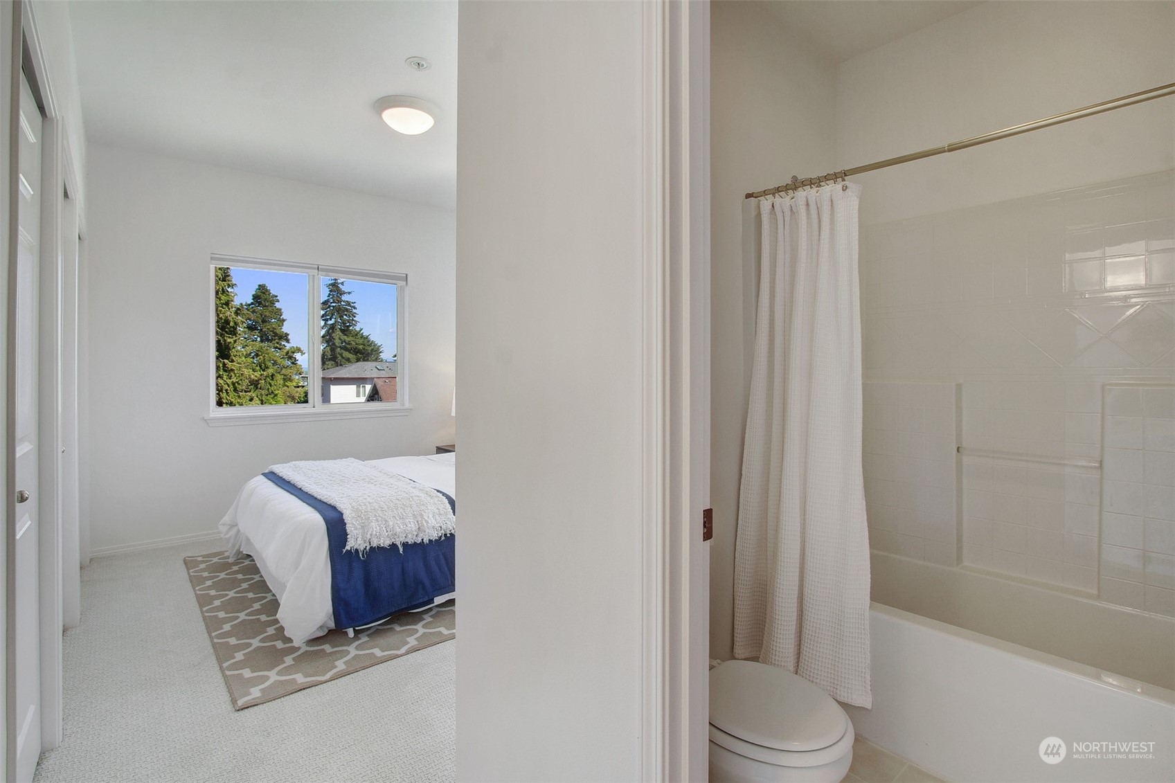 307 North 73rd Street, Unit 5 Seattle, WA 98103 - Photo 7 of 33 a bathroom with a granite countertop sink a toilet and shower