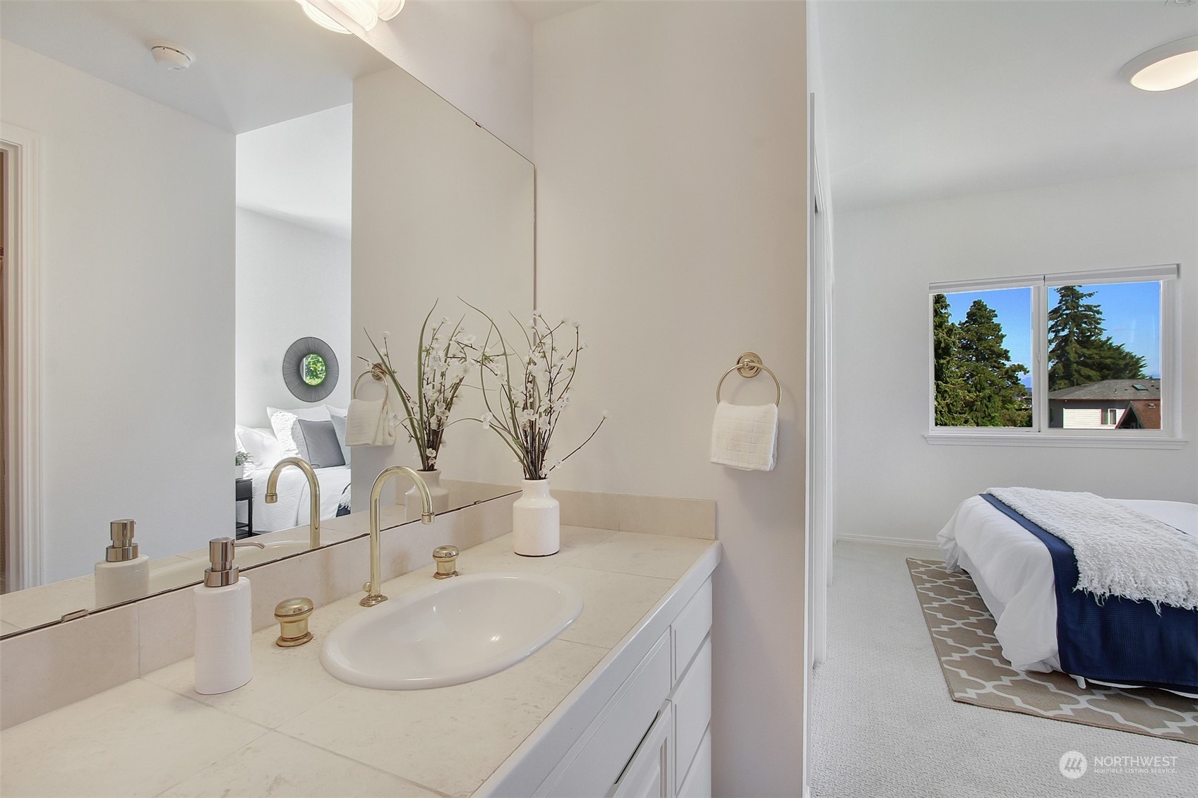 307 North 73rd Street, Unit 5 Seattle, WA 98103 - Photo 8 of 33 a bathroom with a sink and a mirror