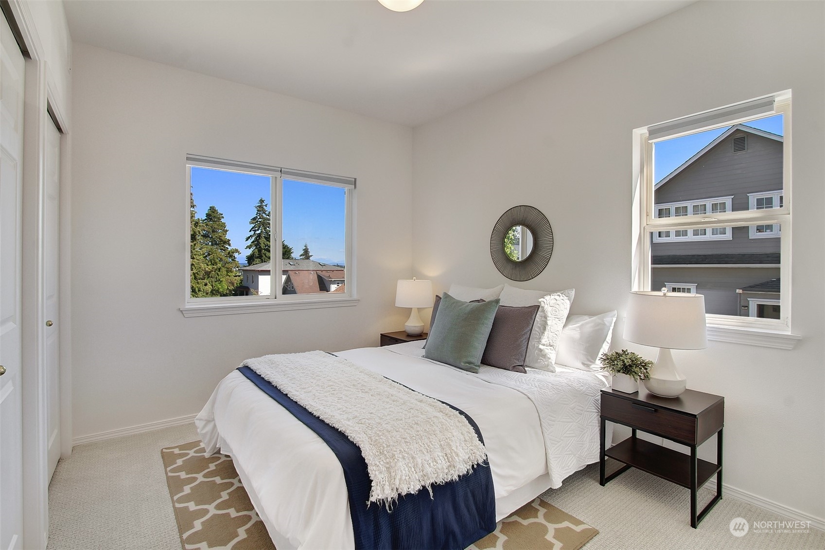 307 North 73rd Street, Unit 5 Seattle, WA 98103 - Photo 9 of 33 a bedroom with a bed and a lamp on table