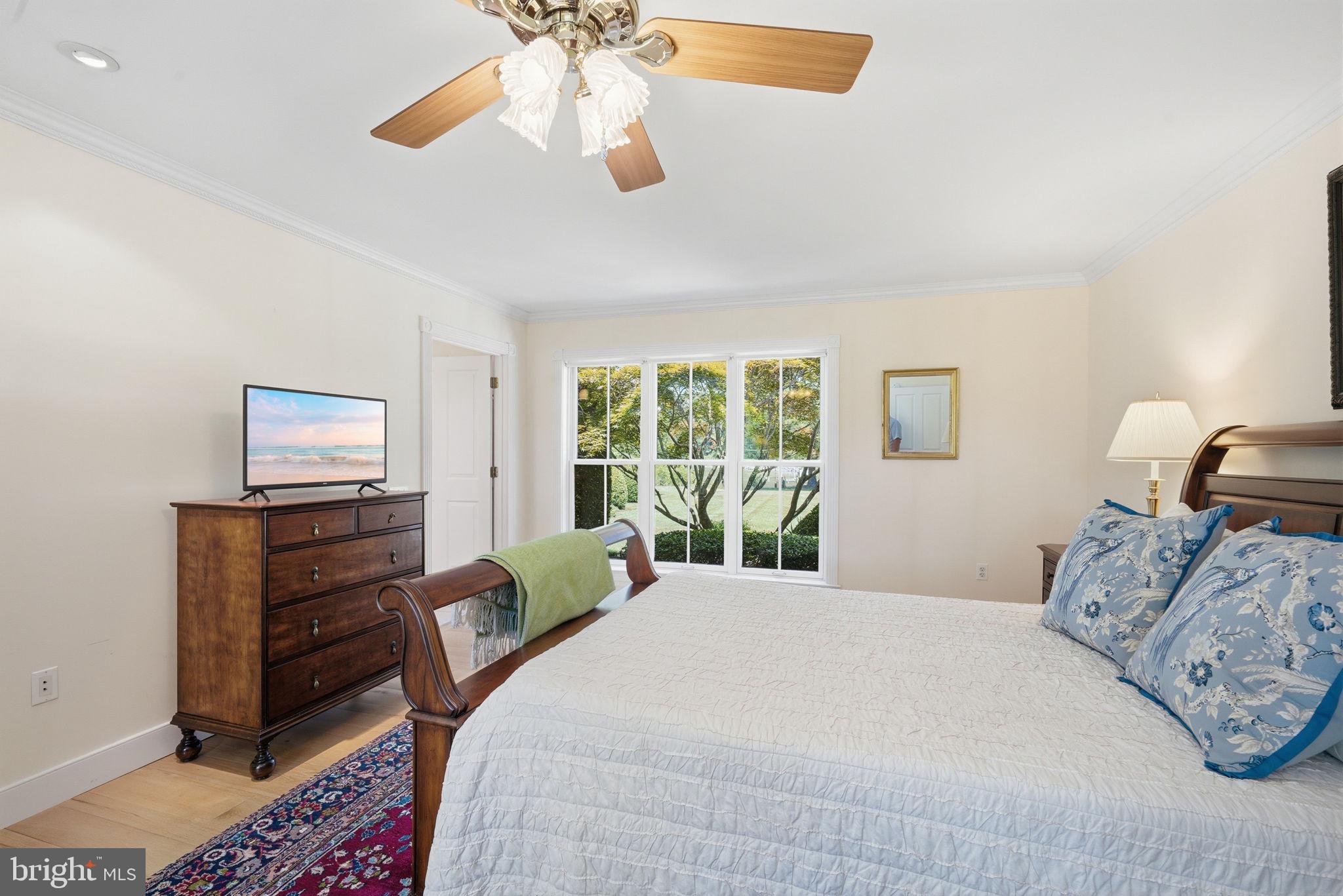 26226 Langs Landing Road Oxford, MD 21654 - Photo 21 of 48 a bedroom with a bed and furniture