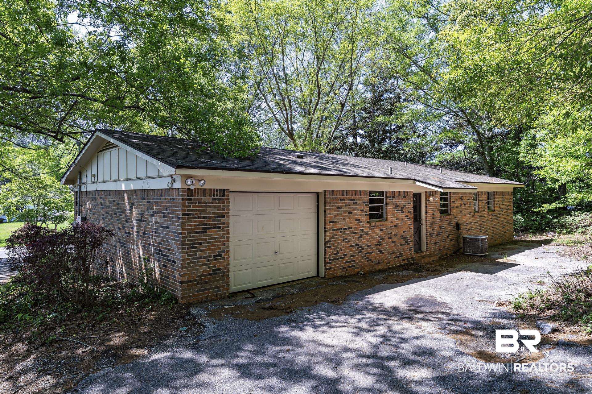 707 Johnson Avenue Fairhope, AL 36532 - Photo 8 of 38 Garage featuring central AC unit