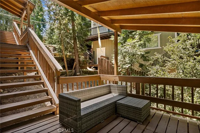 a view of a wooden deck with a bench