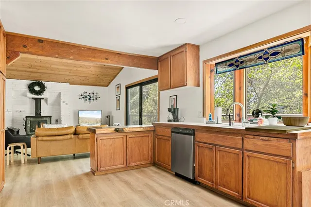 a large white kitchen with a large window