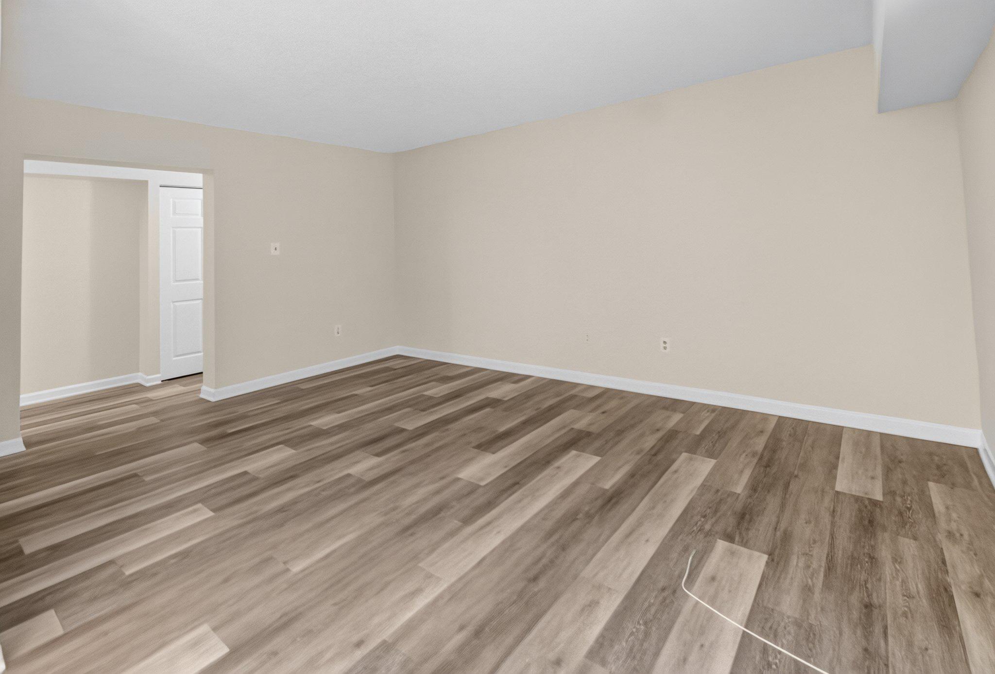 11617 Stoneview Square, Unit 1B Reston, VA 20191 - Photo 16 of 18 Living room with modern flooring.
