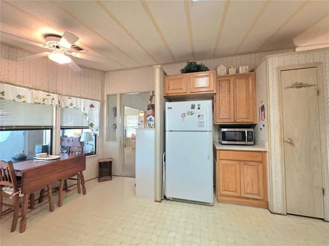 a living room with furniture a window and a lamp