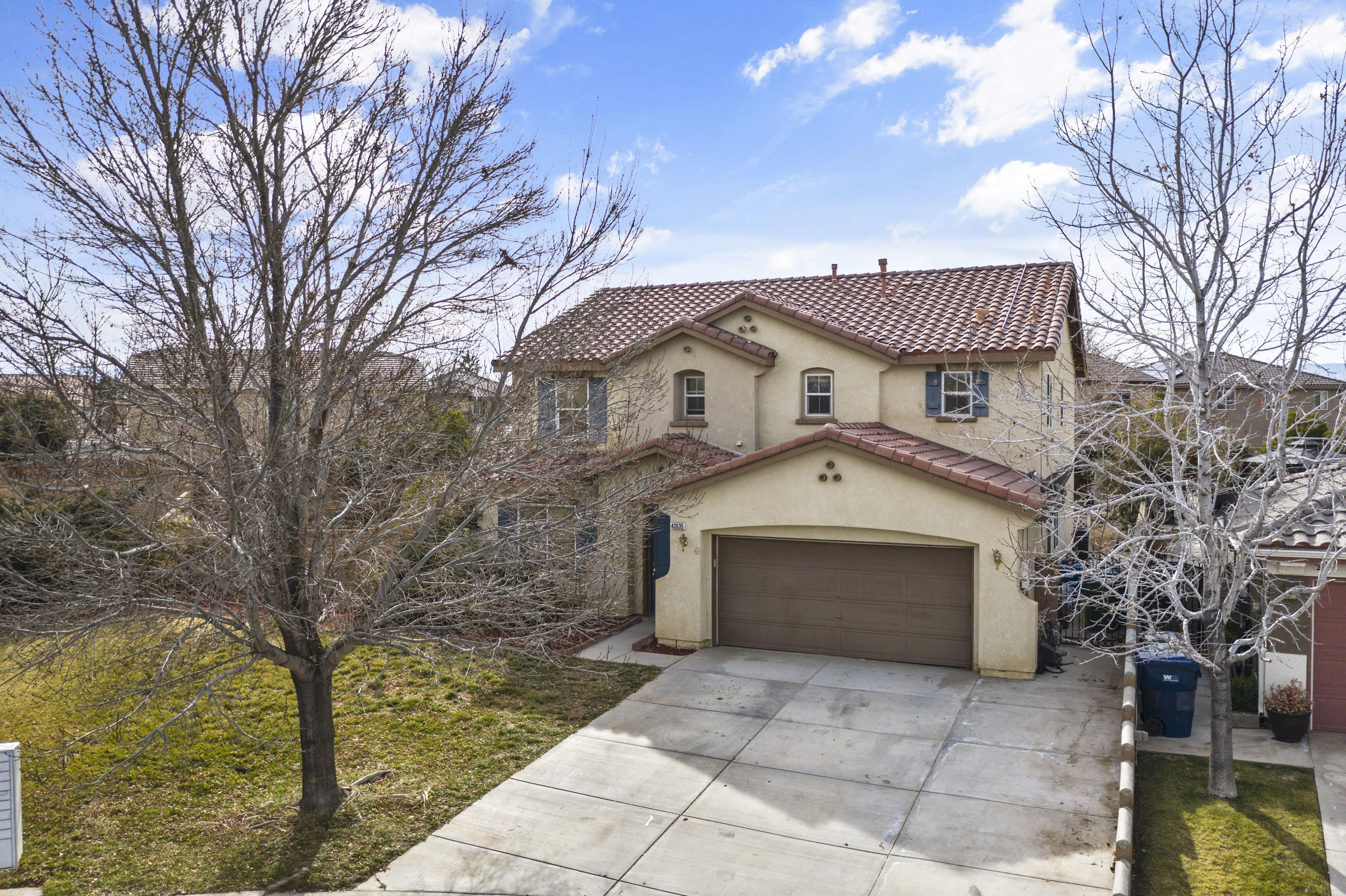 43635 Dana Drive Lancaster, CA 93535 - Photo 1 of 20 a front view of a house with a yard and garage