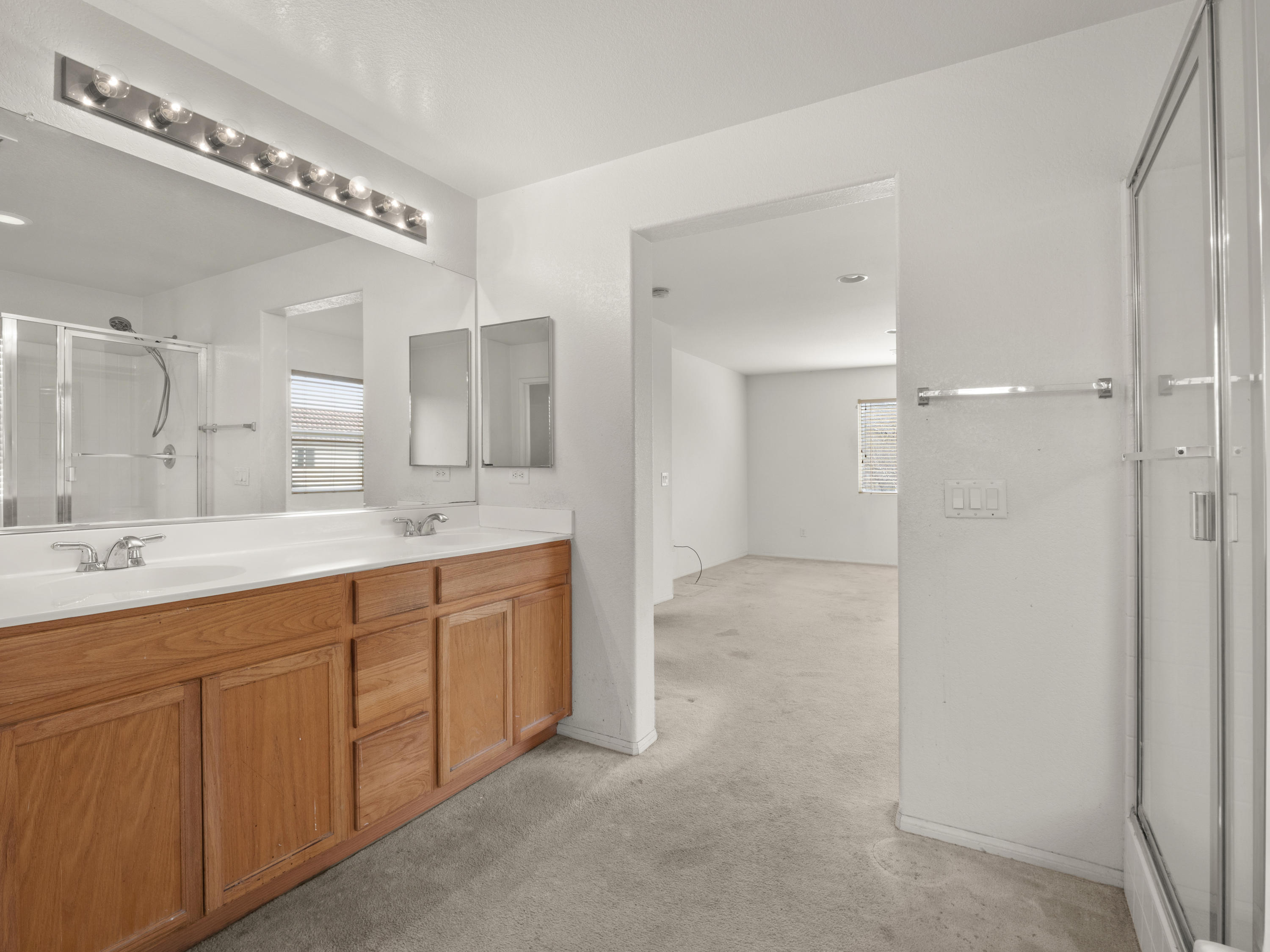 43635 Dana Drive Lancaster, CA 93535 - Photo 13 of 20 a spacious bathroom with a double vanity sink mirror and double