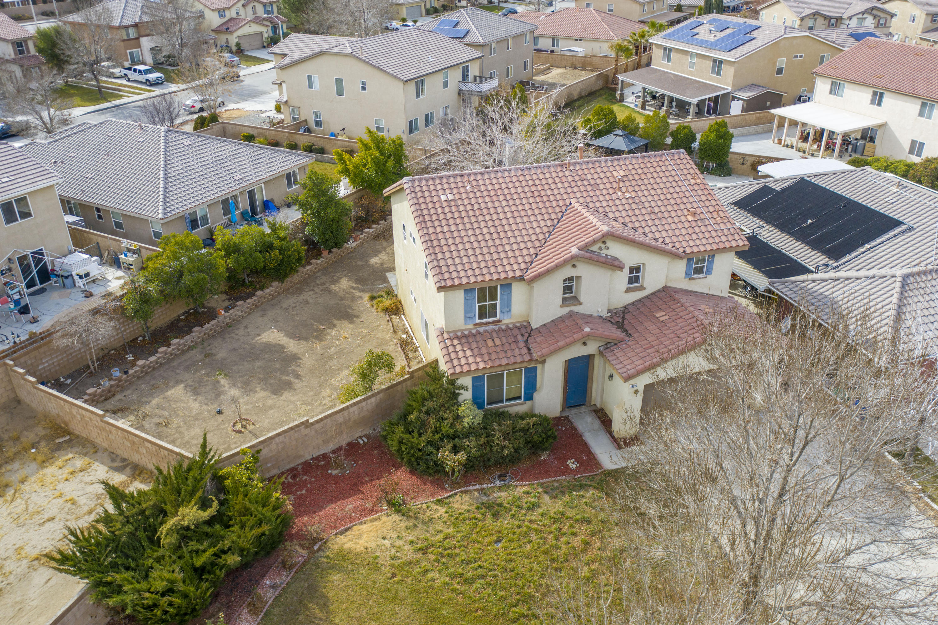 43635 Dana Drive Lancaster, CA 93535 - Photo 2 of 20 an aerial view of a house with a yard and potted plants