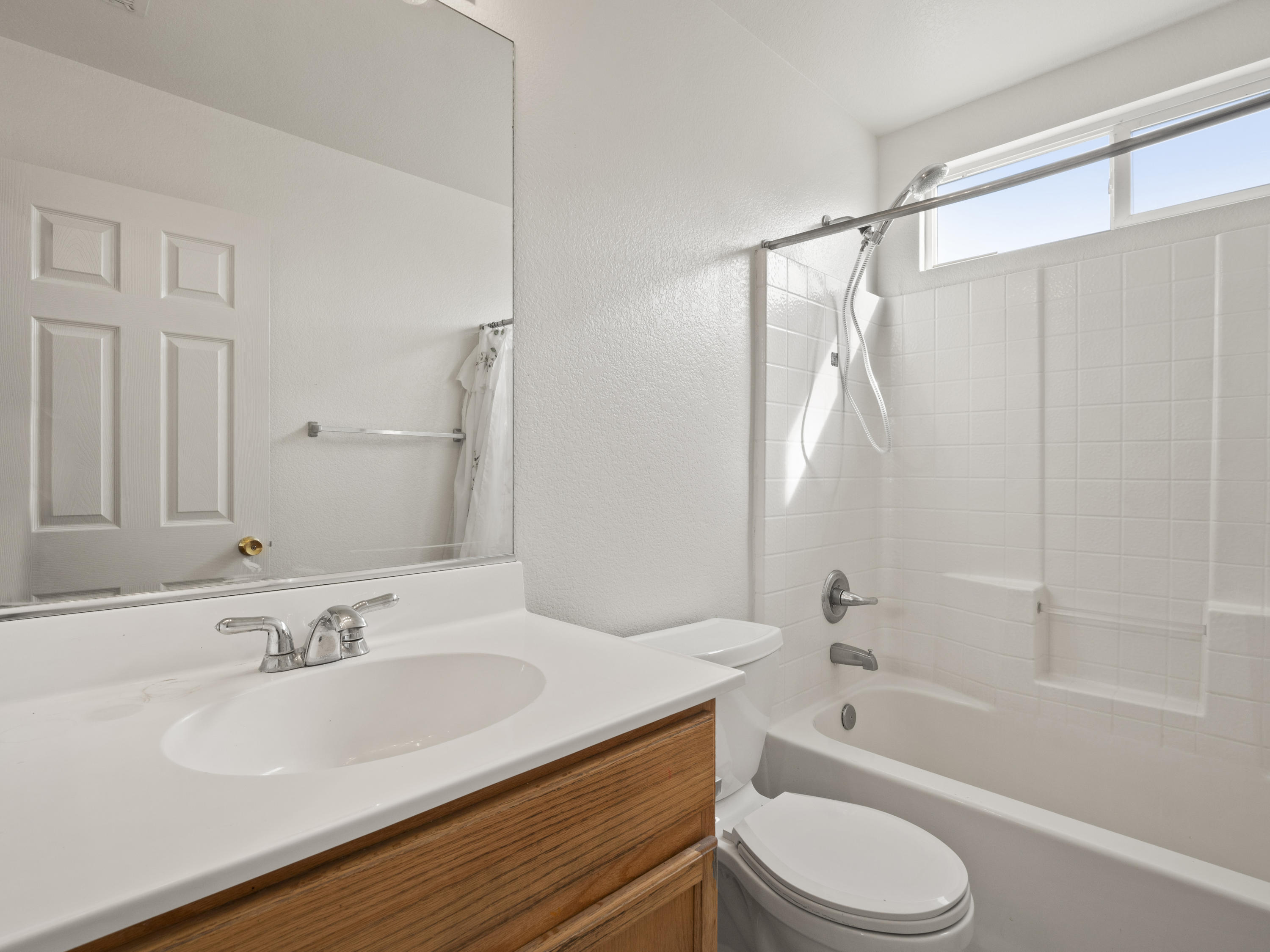 43635 Dana Drive Lancaster, CA 93535 - Photo 6 of 20 a bathroom with a granite countertop sink toilet and shower