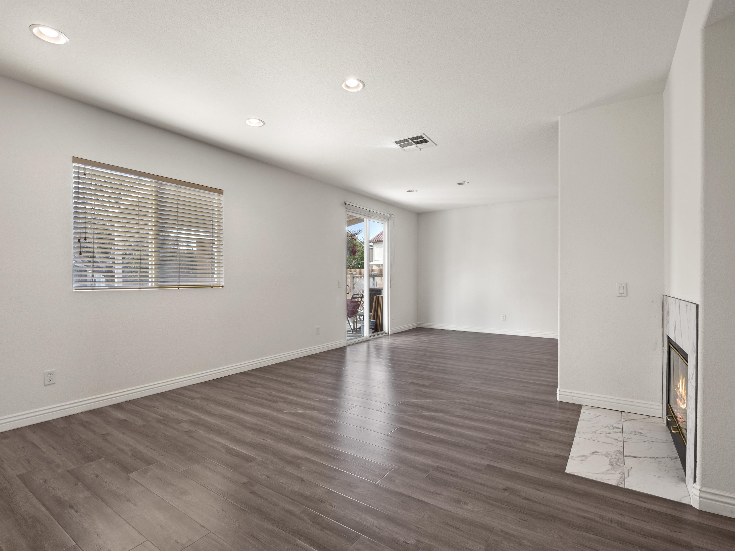 43635 Dana Drive Lancaster, CA 93535 - Photo 8 of 20 a view of empty room with wooden floor and window