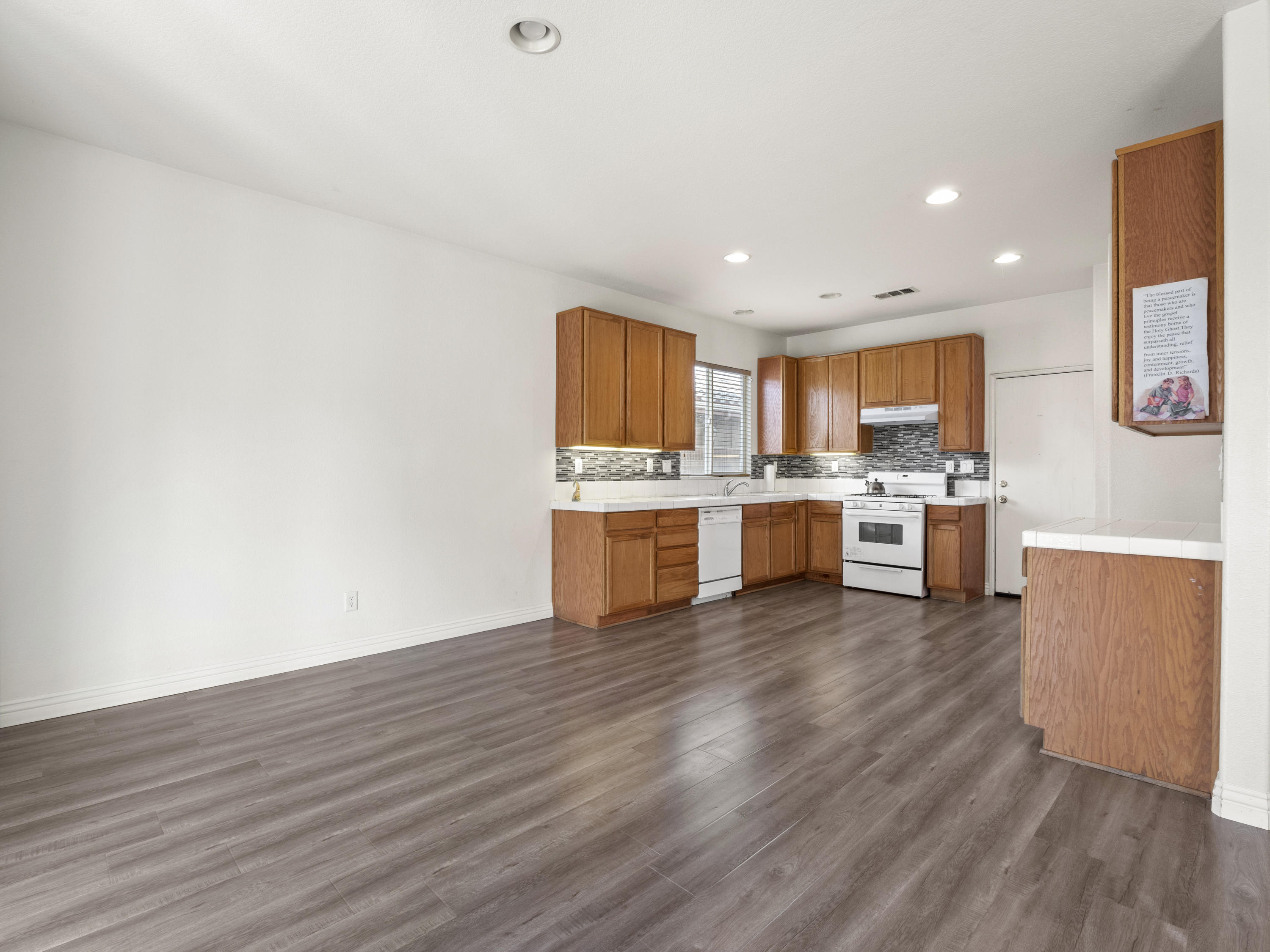 43635 Dana Drive Lancaster, CA 93535 - Photo 10 of 20 a view of kitchen with wooden floor