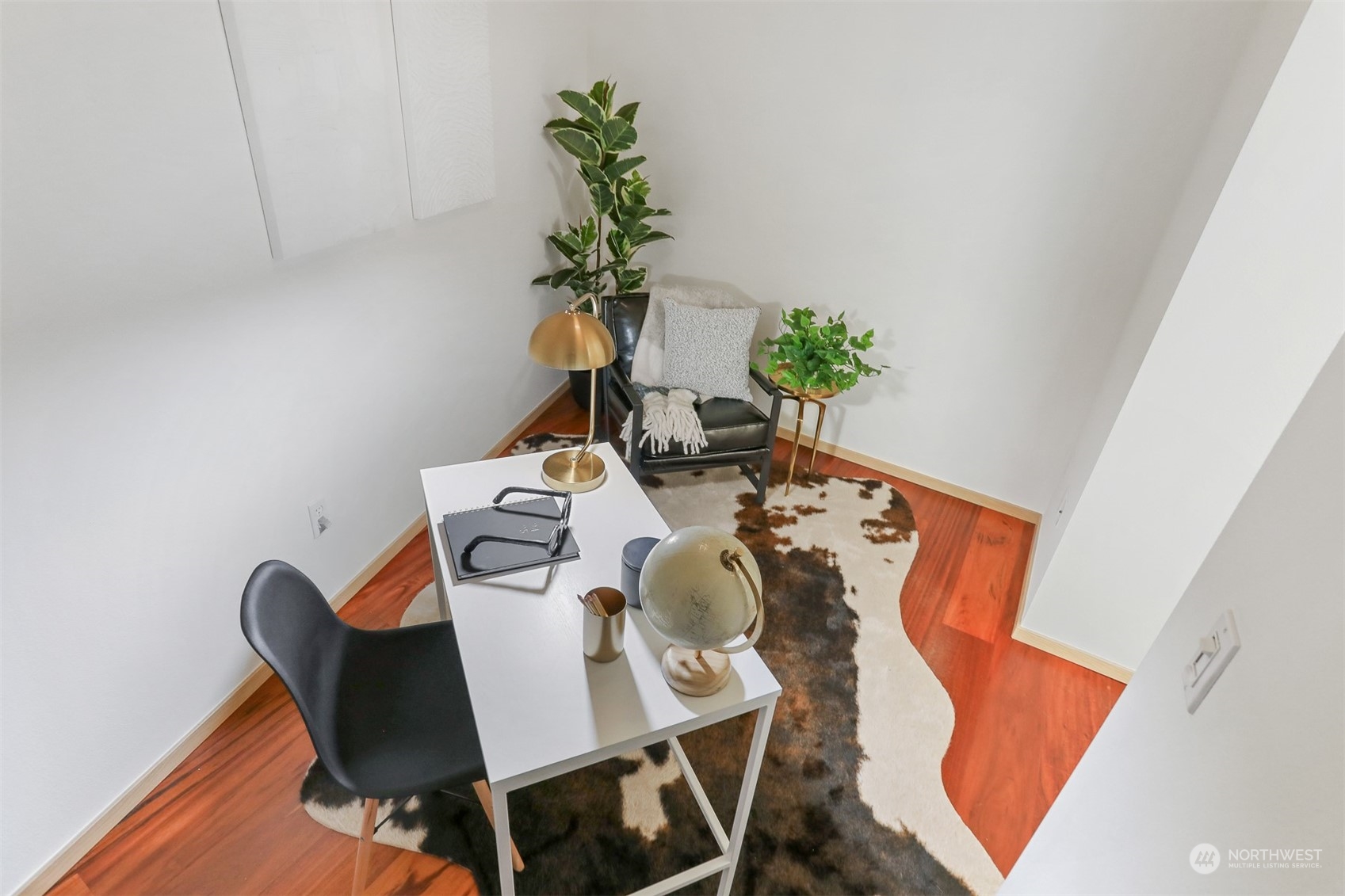 3333 Wallingford Avenue North, Unit 101 Seattle, WA 98103 - Photo 17 of 26 a dining room with furniture and wooden floor