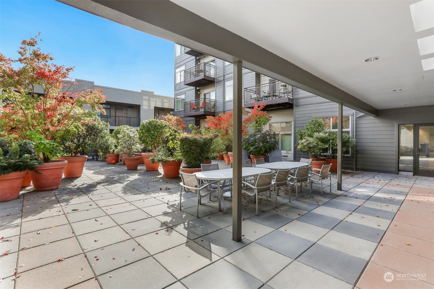 3333 Wallingford Avenue North, Unit 101 Seattle, WA 98103 - Photo 21 of 26 a view of a chairs and tables in the patio