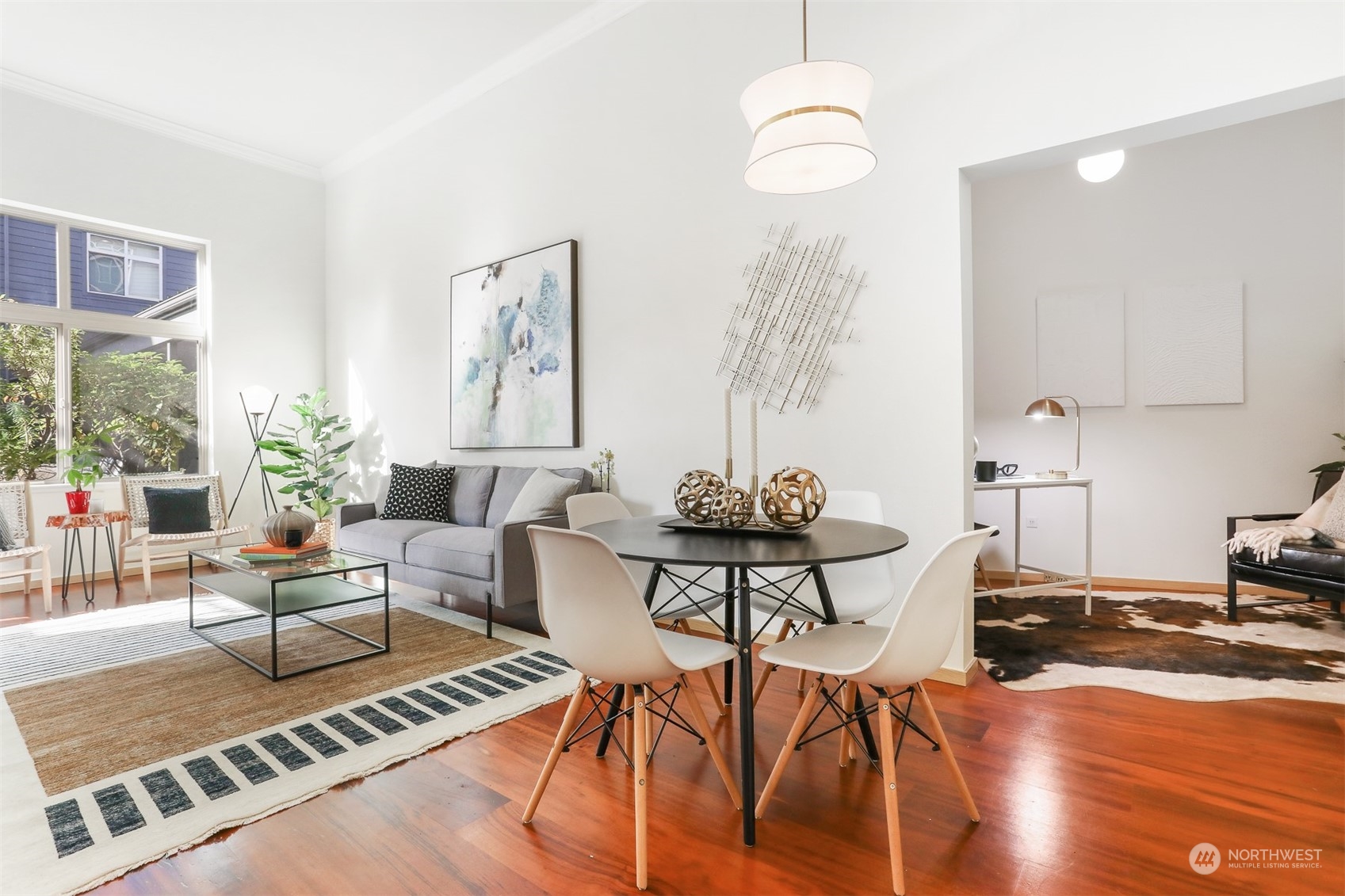 3333 Wallingford Avenue North, Unit 101 Seattle, WA 98103 - Photo 6 of 26 a living room with furniture and wooden floor