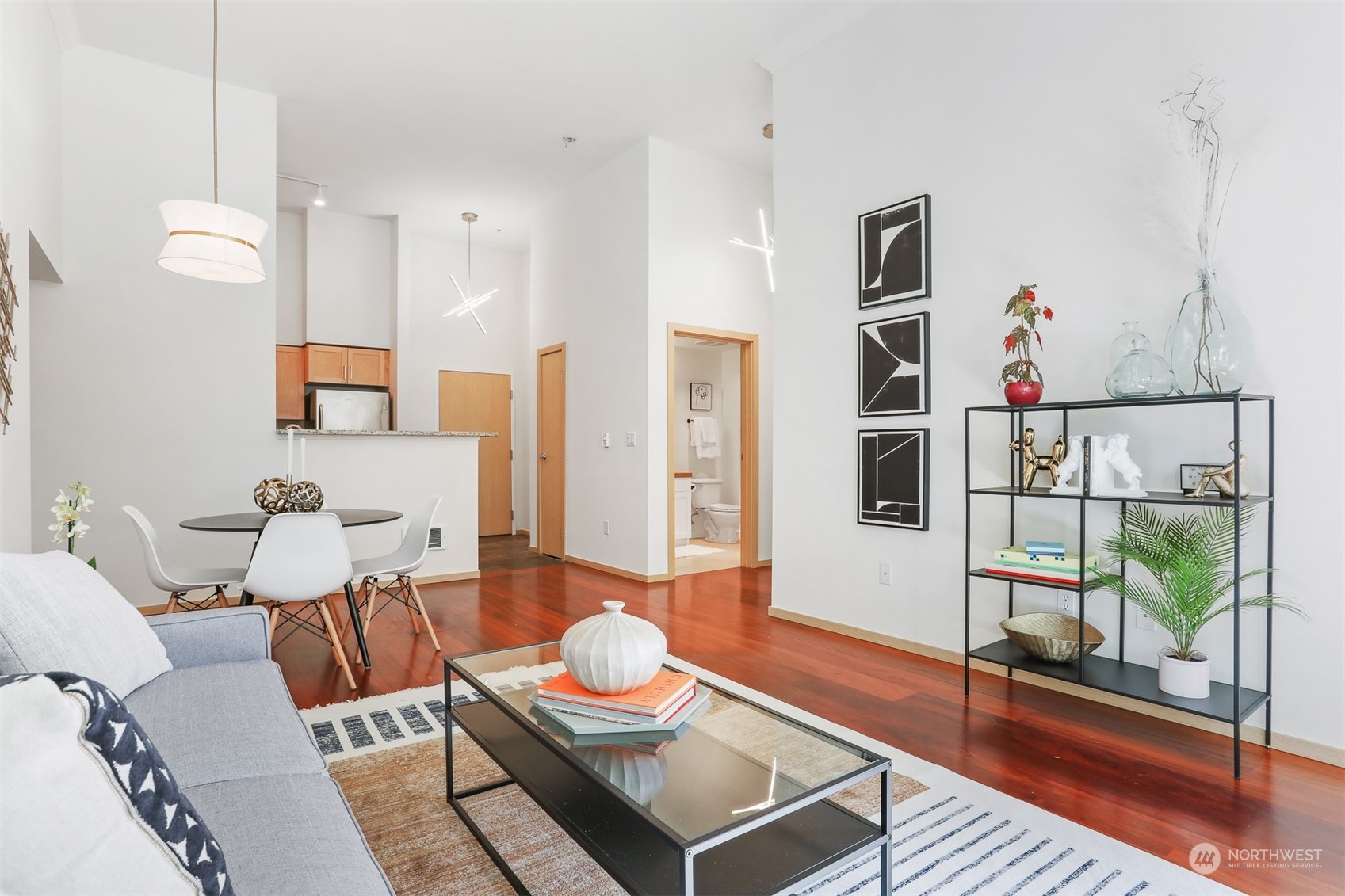 3333 Wallingford Avenue North, Unit 101 Seattle, WA 98103 - Photo 7 of 26 a living room with furniture and a floor to ceiling window