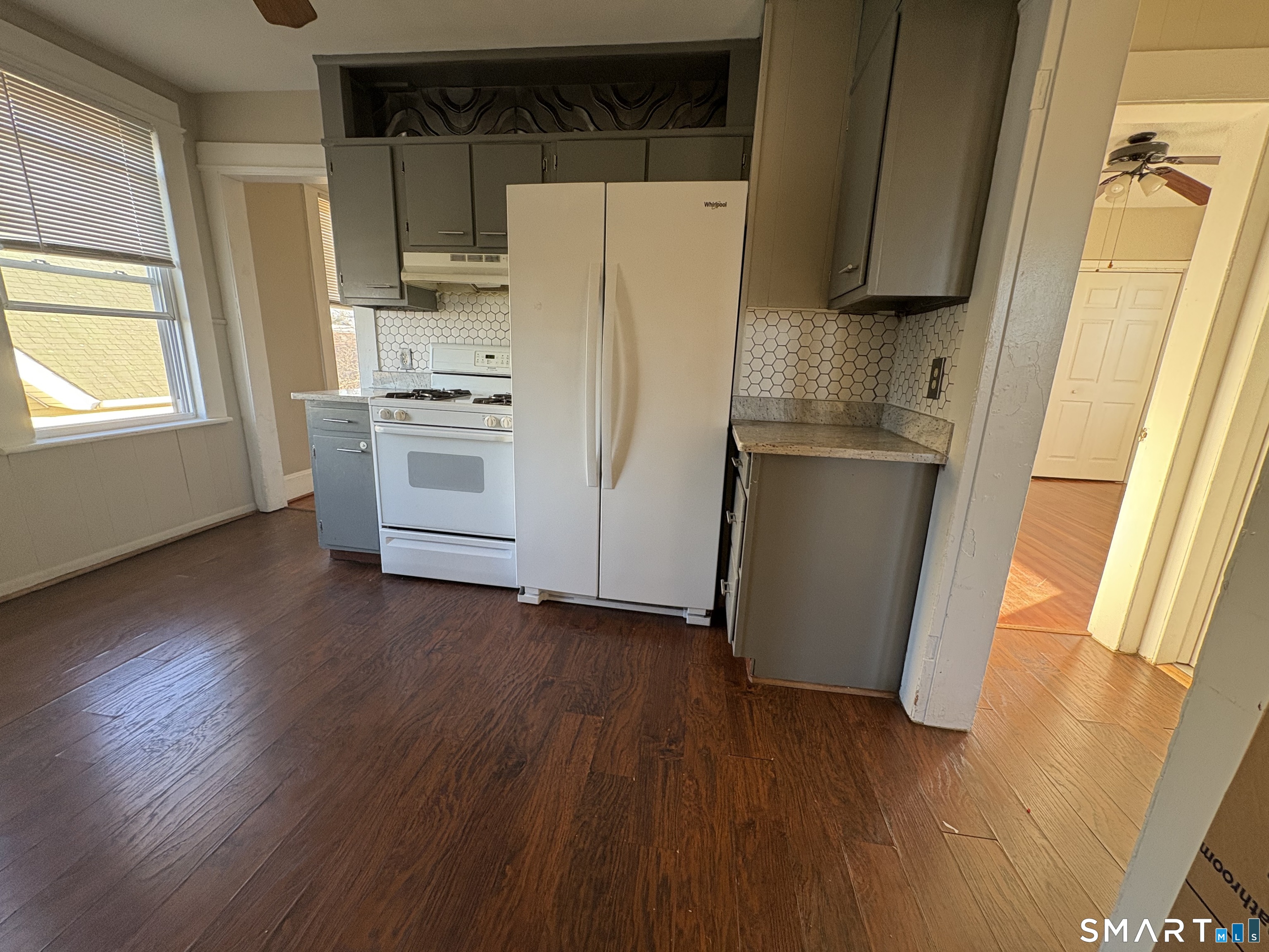 164 French Street, Unit 3 Bridgeport, CT 06606 - Photo 11 of 13 a white refrigerator freezer sitting inside of a kitchen