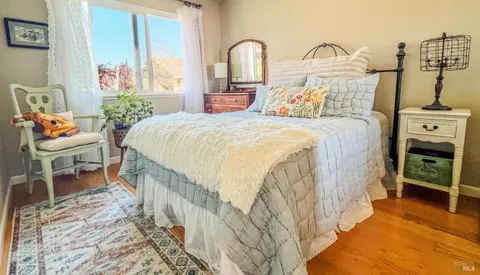 a bedroom with a bed and a view of bedroom